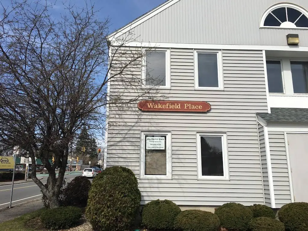 Joy Dental Care - Professional dental clinic exterior with modern facilities