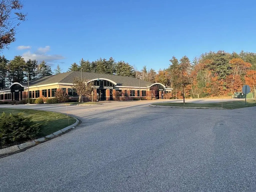 NH Endodontics: Drs. Walsh, Moll, Panda, Jutras, Balloch, Tsai, Kalman & DeLuca - Professional dental clinic exterior with modern facilities