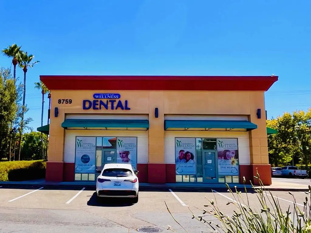 Wellness Dental Care - Professional dental clinic exterior with modern facilities