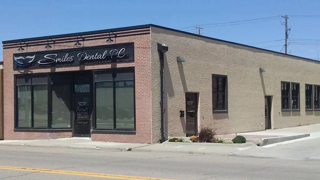 Smiles Dental P.C. - Professional dental clinic exterior with modern facilities