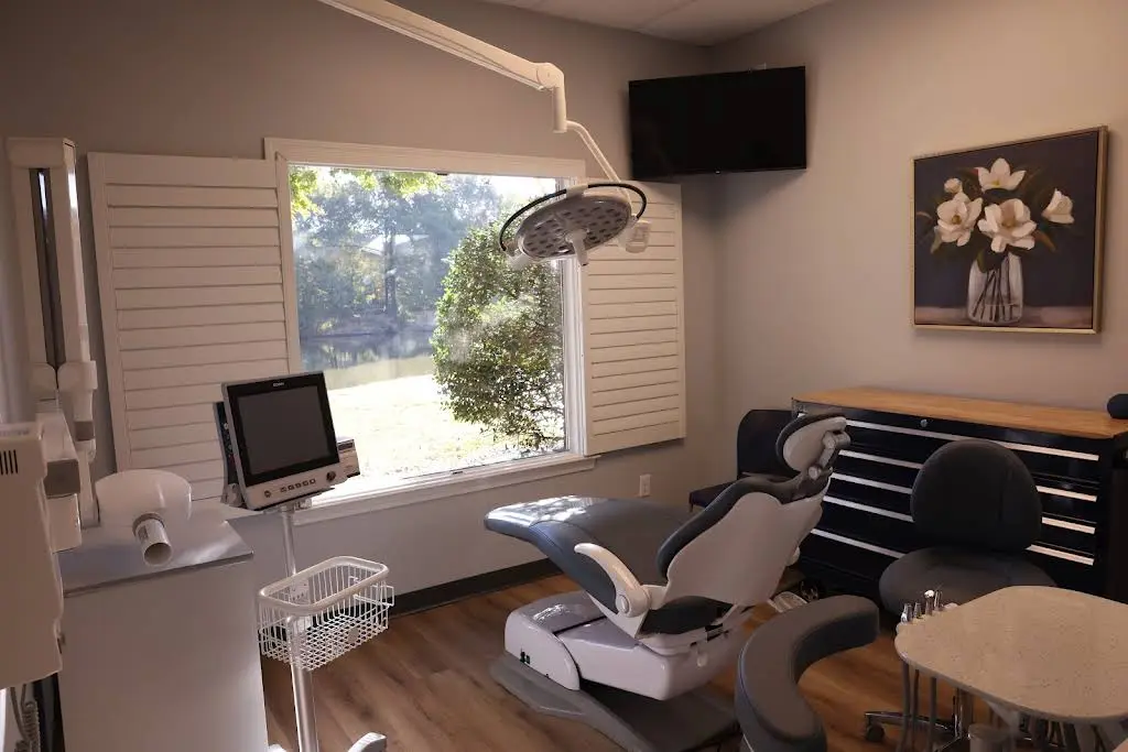 LOVE DENTAL IMPLANTS & DENTURES - Professional dental clinic exterior with modern facilities