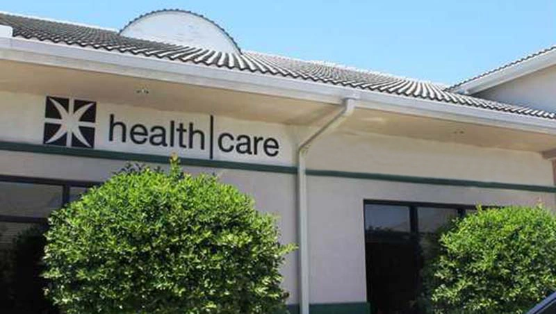 Healthcare Network - Professional dental clinic exterior with modern facilities