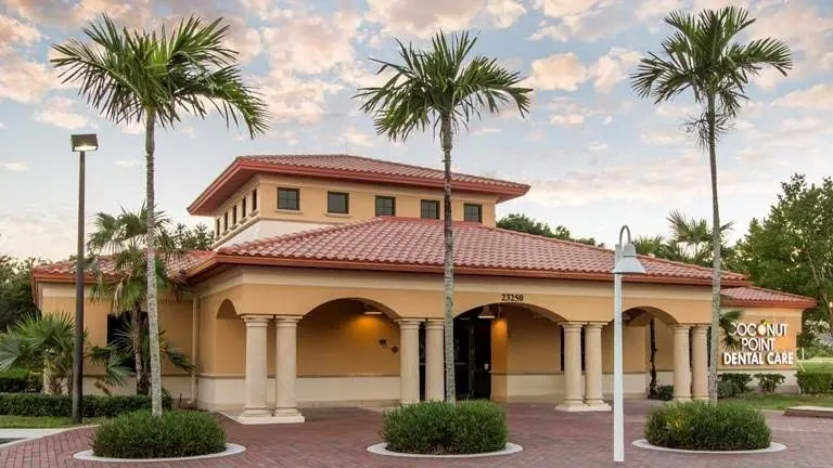 Coconut Point Dental Care - Professional dental clinic exterior with modern facilities