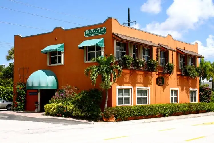 Riverview Cosmetic & Implant Dentistry - Professional dental clinic exterior with modern facilities