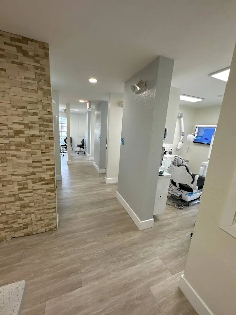 Smiles by Dr. Albert & Associates - Professional dental clinic exterior with modern facilities