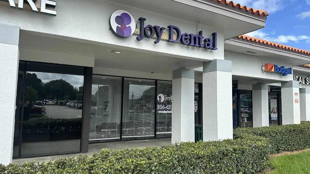 Joy Dental Pines - Professional dental clinic exterior with modern facilities