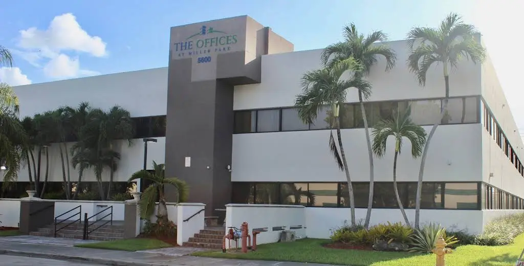 M&C Dental Services - Professional dental clinic exterior with modern facilities