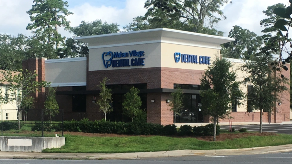Mahan Village Dental Care - Professional dental clinic exterior with modern facilities